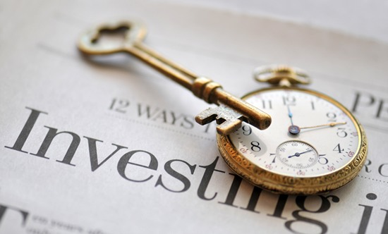 Newspaper Investing With Antique Watch and Key