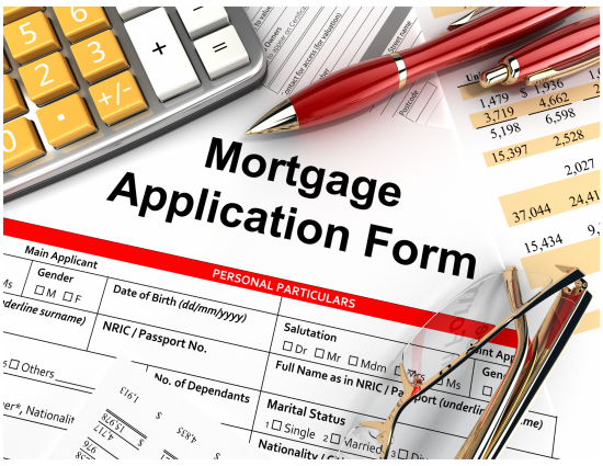 Mortgage application form with calculator and pen